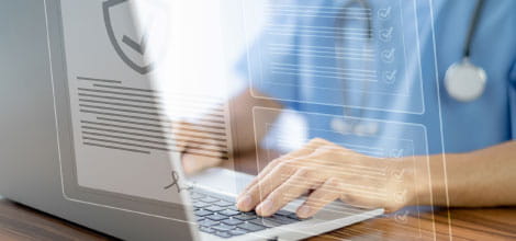 Doctor using laptop